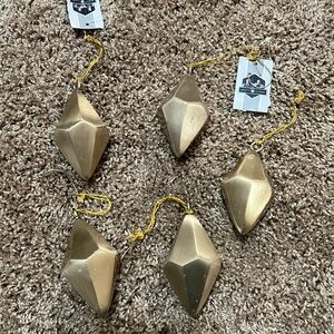 5 gold Scott living ornaments.  All new. A few scuffs
